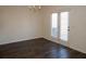 Empty dining area boasting wood floors, a modern chandelier, and glass doors at 443 Faulkner St, Stockbridge, GA 30281