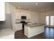 Bright, open kitchen featuring stainless appliances and a large center island at 443 Faulkner St, Stockbridge, GA 30281