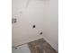 Utility area with vinyl flooring and hook-ups for a washer and dryer at 443 Faulkner St, Stockbridge, GA 30281