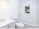 Bright bathroom featuring a white bathtub, toilet, walls, and vanity, creating a clean and modern look at 451 Collier Ridge Dr, Atlanta, GA 30318