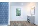 Bathroom with shower, vanity, and a window that provides natural light at 451 Collier Ridge Dr, Atlanta, GA 30318