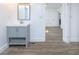 Bathroom with gray vanity, white countertop, mirror, and modern lighting at 451 Collier Ridge Dr, Atlanta, GA 30318