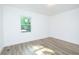 Bright bedroom with white walls and wood flooring overlooking backyard at 451 Collier Ridge Dr, Atlanta, GA 30318