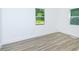 Bright bedroom boasts new flooring and ample natural light from the window at 451 Collier Ridge Dr, Atlanta, GA 30318