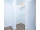 Bright walk-in closet features laminate flooring and open shelving at 451 Collier Ridge Dr, Atlanta, GA 30318