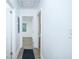 Bright hallway with wood-look flooring and white walls, creating a fresh and inviting space at 451 Collier Ridge Dr, Atlanta, GA 30318