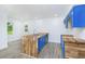 Bright kitchen with butcher block island, blue cabinets, and stainless steel appliances, a chef's dream at 451 Collier Ridge Dr, Atlanta, GA 30318