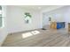 Open concept living space featuring vinyl floors and a kitchen island with seating at 451 Collier Ridge Dr, Atlanta, GA 30318