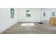 An open-concept living space with vinyl plank flooring, white walls, and natural light at 451 Collier Ridge Dr, Atlanta, GA 30318