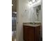 Bathroom with a granite countertop vanity and decorative fixtures at 6980 Roswell Rd # E11, Atlanta, GA 30328