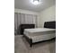 Bedroom with a bed, dresser, carpet, and natural light from the window at 6980 Roswell Rd # E11, Atlanta, GA 30328