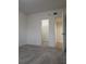 A bedroom has two closets and neutral carpet at 6980 Roswell Rd # E11, Atlanta, GA 30328