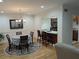 Cozy dining room with a round table, a chandelier, and an open view to the kitchen at 6980 Roswell Rd # E11, Atlanta, GA 30328