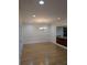 Spacious dining room featuring hardwood floors, recessed lighting, and classic chandelier at 6980 Roswell Rd # E11, Atlanta, GA 30328