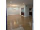 Open concept layout of the dining room that features hardwood flooring and an adjacent kitchen at 6980 Roswell Rd # E11, Atlanta, GA 30328