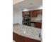 A kitchen with stainless steel appliances, wooden cabinets, and granite countertops at 6980 Roswell Rd # E11, Atlanta, GA 30328