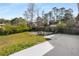 Spacious backyard with grass and a concrete patio area, partially fenced at 2600 Cohassett Ct, Decatur, GA 30034