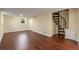 Spacious finished basement with modern flooring and a unique spiral staircase at 2600 Cohassett Ct, Decatur, GA 30034