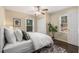Cozy bedroom with a ceiling fan, two windows and a decorative rug at 2600 Cohassett Ct, Decatur, GA 30034