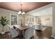 Bright dining room with hardwood floors, neutral decor, and an open layout to the living area at 2600 Cohassett Ct, Decatur, GA 30034