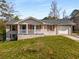Charming brick home with a welcoming front porch and a convenient one-car garage at 2600 Cohassett Ct, Decatur, GA 30034