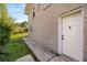 Rear view of a brick house and white door with walkway at 2600 Cohassett Ct, Decatur, GA 30034