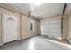 Clean and well-lit garage interior with a white garage door at 2600 Cohassett Ct, Decatur, GA 30034