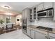 Bright kitchen featuring stainless steel appliances, granite countertops, and a view of the dining area at 2600 Cohassett Ct, Decatur, GA 30034