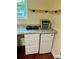 Basement kitchenette features a mini fridge, cooktop, and granite countertop at 2600 Cohassett Ct, Decatur, GA 30034