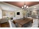 Inviting living room and dining room area featuring hardwood floors and modern finishes with stainless steel kitchen appliances at 2600 Cohassett Ct, Decatur, GA 30034