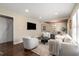 Bright and airy living room featuring hardwood floors, neutral colors, and ample natural light at 2600 Cohassett Ct, Decatur, GA 30034