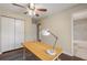 Home office with wooden desk and attached bathroom at 2600 Cohassett Ct, Decatur, GA 30034