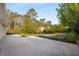Large patio with raised garden beds, ideal for outdoor gardening and enjoying the scenery at 2600 Cohassett Ct, Decatur, GA 30034