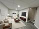 Finished basement with seating area, television, and minimalist decor at 147 Hermer Nw Cir, Atlanta, GA 30311