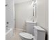 Neat and tidy bathroom with subway tile, modern fixtures, and neutral paint with light wood flooring at 147 Hermer Nw Cir, Atlanta, GA 30311