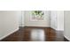 Bright bedroom with hardwood floors, fresh paint, and ample natural light with views of the exterior yard at 147 Hermer Nw Cir, Atlanta, GA 30311