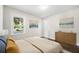 Bright bedroom with hardwood floors, a large window, and stylish furnishings at 147 Hermer Nw Cir, Atlanta, GA 30311