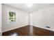 Bright bedroom with hardwood floors, large window and neutral wall color at 147 Hermer Nw Cir, Atlanta, GA 30311