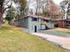Charming single Gathering home with green paint and a well manicured lawn at 147 Hermer Nw Cir, Atlanta, GA 30311