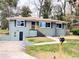 Charming single Gathering home with green paint and a well manicured lawn at 147 Hermer Nw Cir, Atlanta, GA 30311
