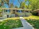 Charming renovated single-story home with modern gray paint, dark shutters, and a freshly landscaped front yard at 147 Hermer Nw Cir, Atlanta, GA 30311