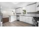 Updated kitchen features stainless steel appliances, granite countertops and white shaker cabinets at 147 Hermer Nw Cir, Atlanta, GA 30311