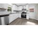 Bright kitchen offers stainless appliances, granite countertops and access to outdoor space at 147 Hermer Nw Cir, Atlanta, GA 30311
