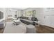 Bright living room with large windows, contemporary furniture, and hardwood floors at 147 Hermer Nw Cir, Atlanta, GA 30311