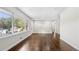 Inviting living room featuring hardwood flooring and a large window with neighborhood views at 147 Hermer Nw Cir, Atlanta, GA 30311