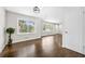 Inviting living room with hardwood floors, large windows, and a bright, welcoming atmosphere at 147 Hermer Nw Cir, Atlanta, GA 30311