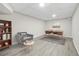 Bright home office featuring wood desk, grey accent chair, and natural light at 147 Hermer Nw Cir, Atlanta, GA 30311