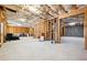 Unfinished basement with exposed beams, concrete walls, and a concrete floor at 1595 Johnstown Trace, Suwanee, GA 30024