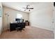 Bedroom featuring neutral colored walls and carpeting with a ceiling fan at 1595 Johnstown Trace, Suwanee, GA 30024