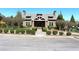 Community clubhouse entrance with landscaping and playground equipment at 1595 Johnstown Trace, Suwanee, GA 30024